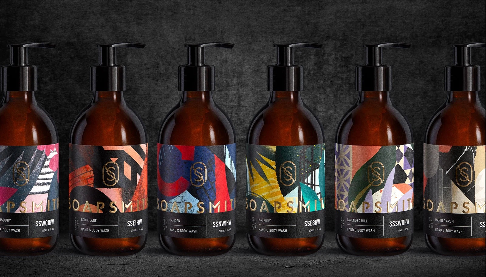 Six Soapsmith wash bottles showing the illustrated London scent labels